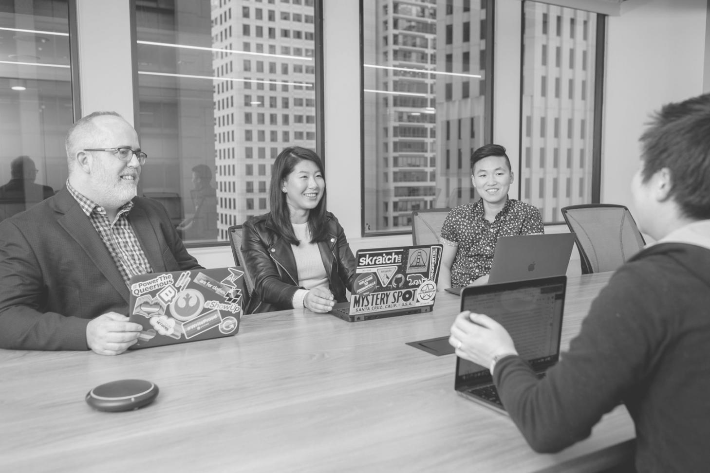 Program graduates presenting their capstone projects to industry professionals